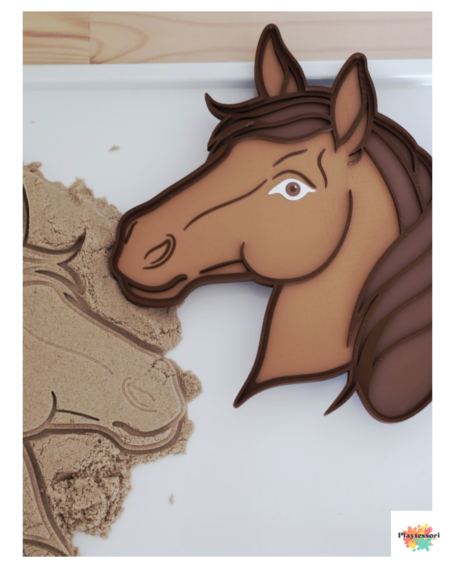 Horse-shaped tray on a white surface with a wooden background