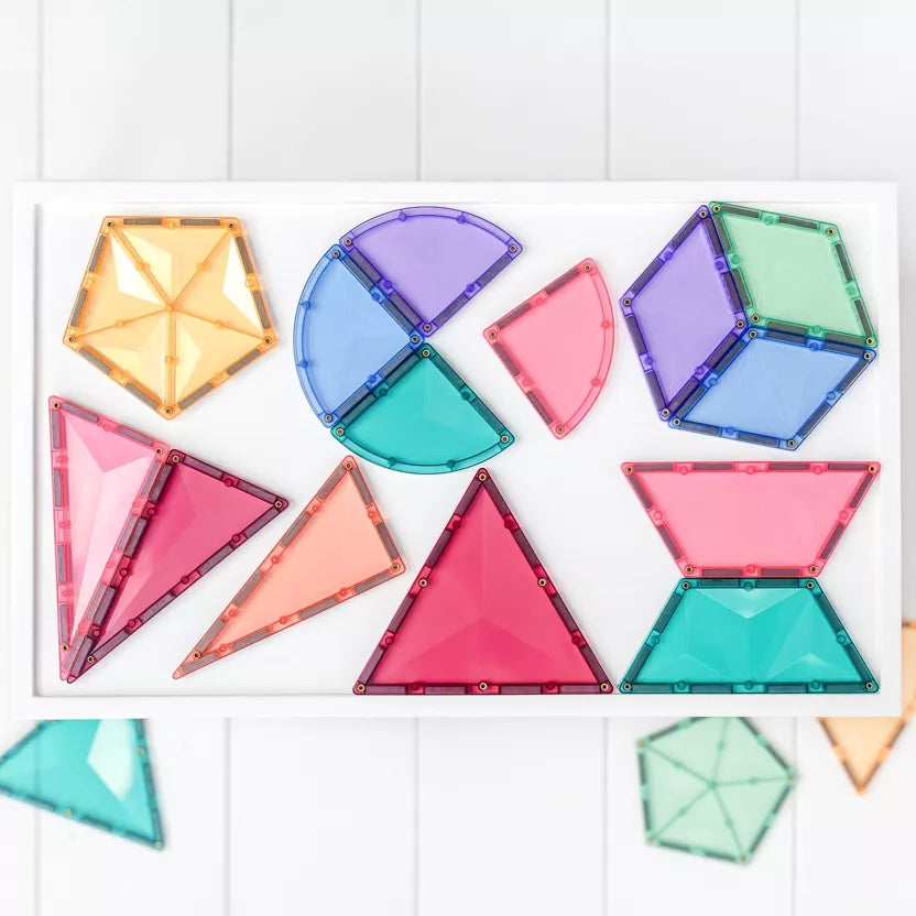 Colorful geometric transparent building blocks on a white background
