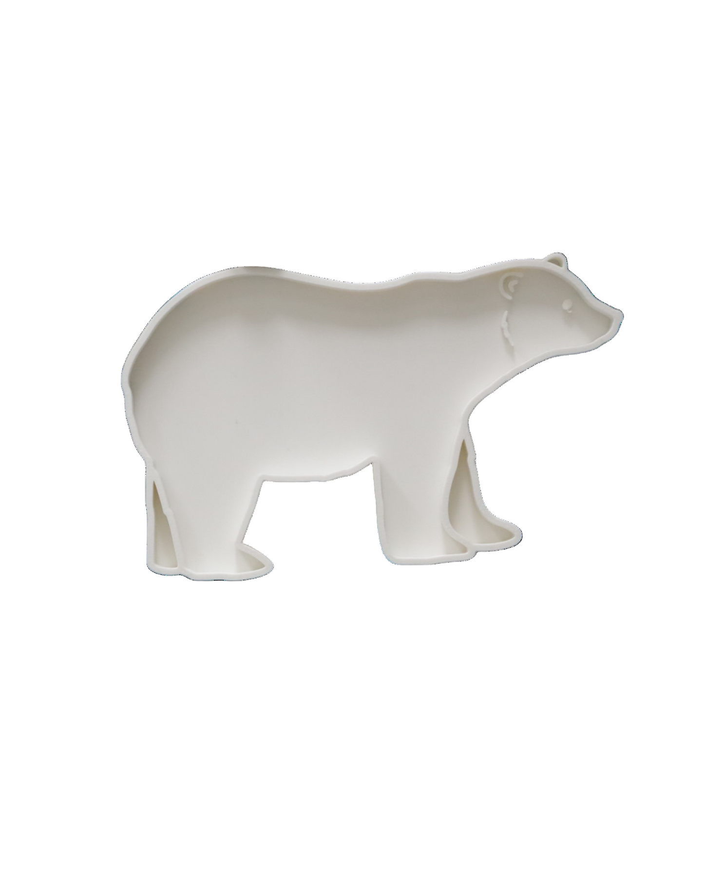 Biała wysypywanka sensoryczna w kształcie niedźwiedzia polarnego na białym tle.