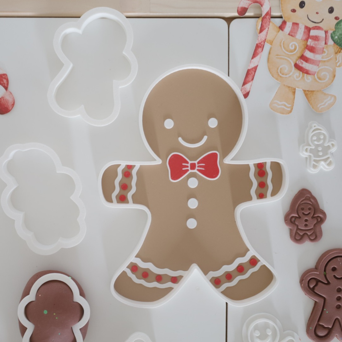 Close-up of Montessori gingerbread sensory tray and cookie cutters – handmade 3D printed design for eco-friendly, open-ended winter play.