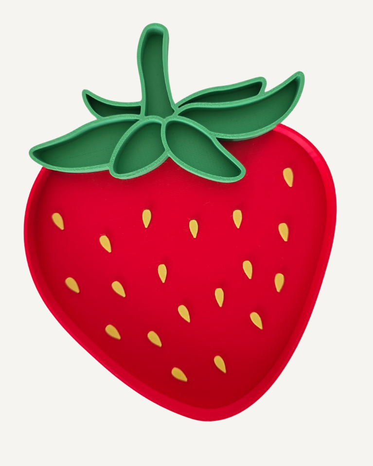 Strawberry-shaped tray with green stem on a white background