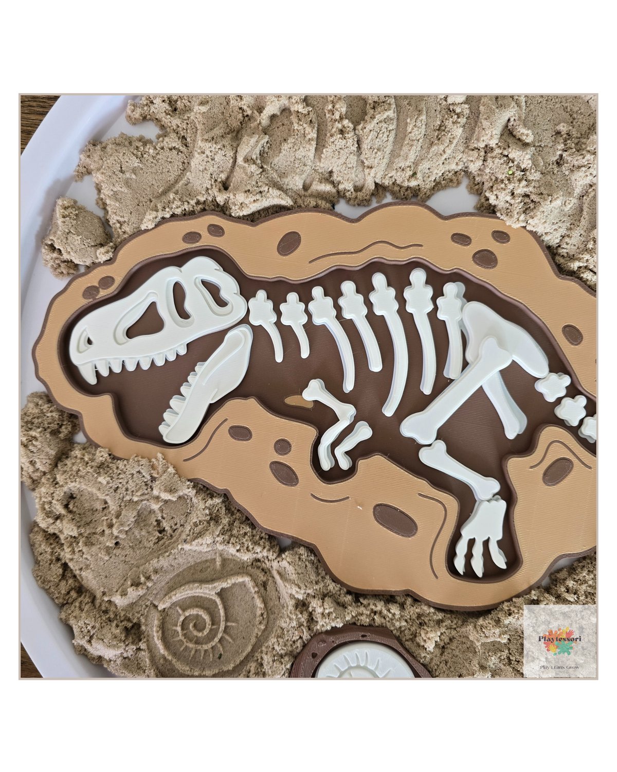 Close-up of layered 3D dinosaur fossil shapes designed for fine motor development