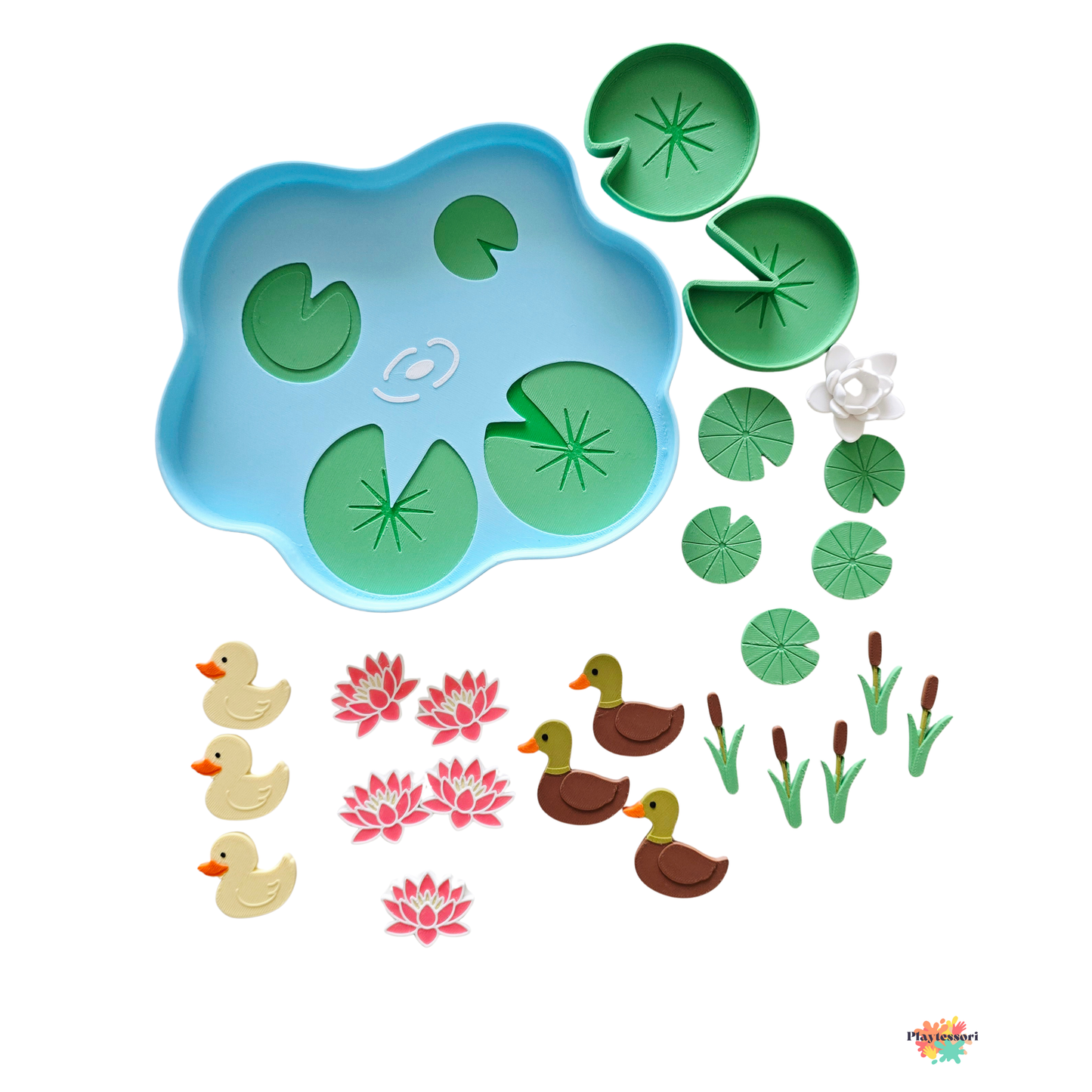 Pond sorting tray set with 24 pieces including ducks, lily pads, lotus flowers and cattails laid out
