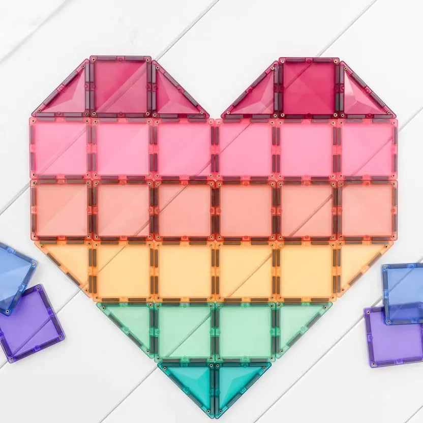 Colorful heart-shaped building block set on a light gray background