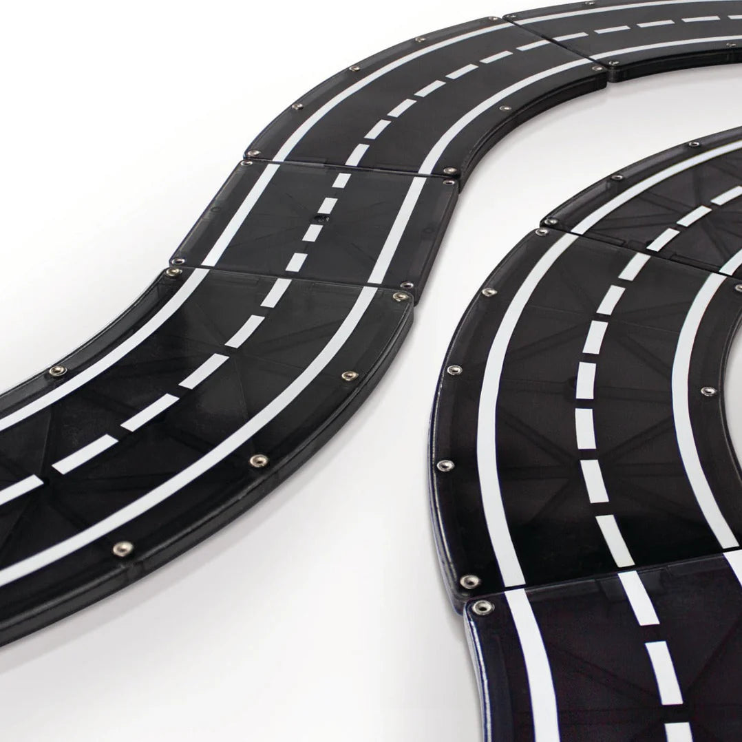 Black and white toy race track set on a white background