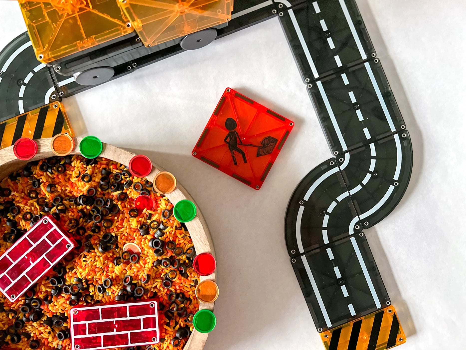 Toy pizza with roadways and colorful blocks on a white background