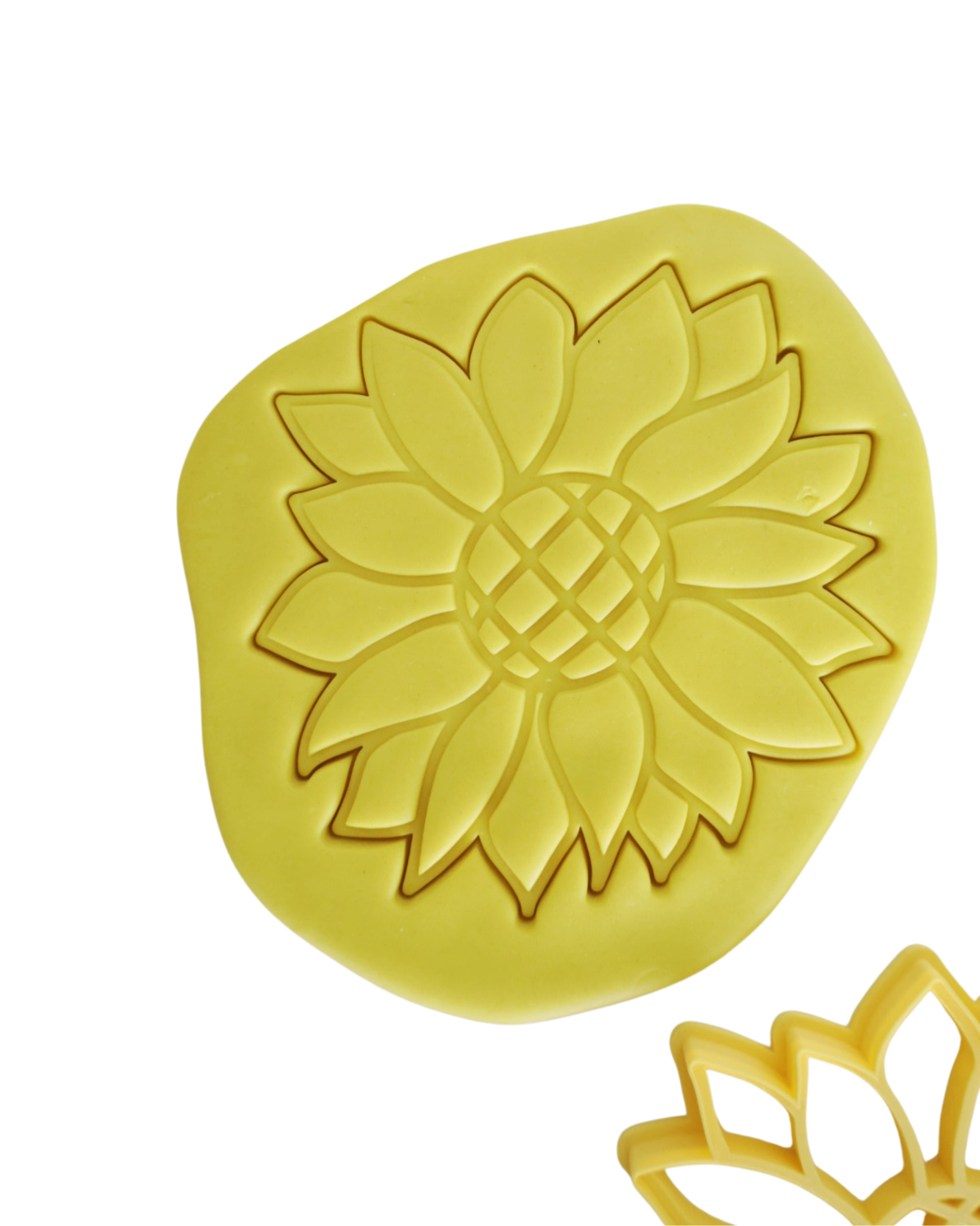 Detailed sunflower embossed impression in yellow playdough made with XXL Playtessori sunflower cutter showing full petal and seed head texture — Montessori playdough activity for toddlers and preschoolers