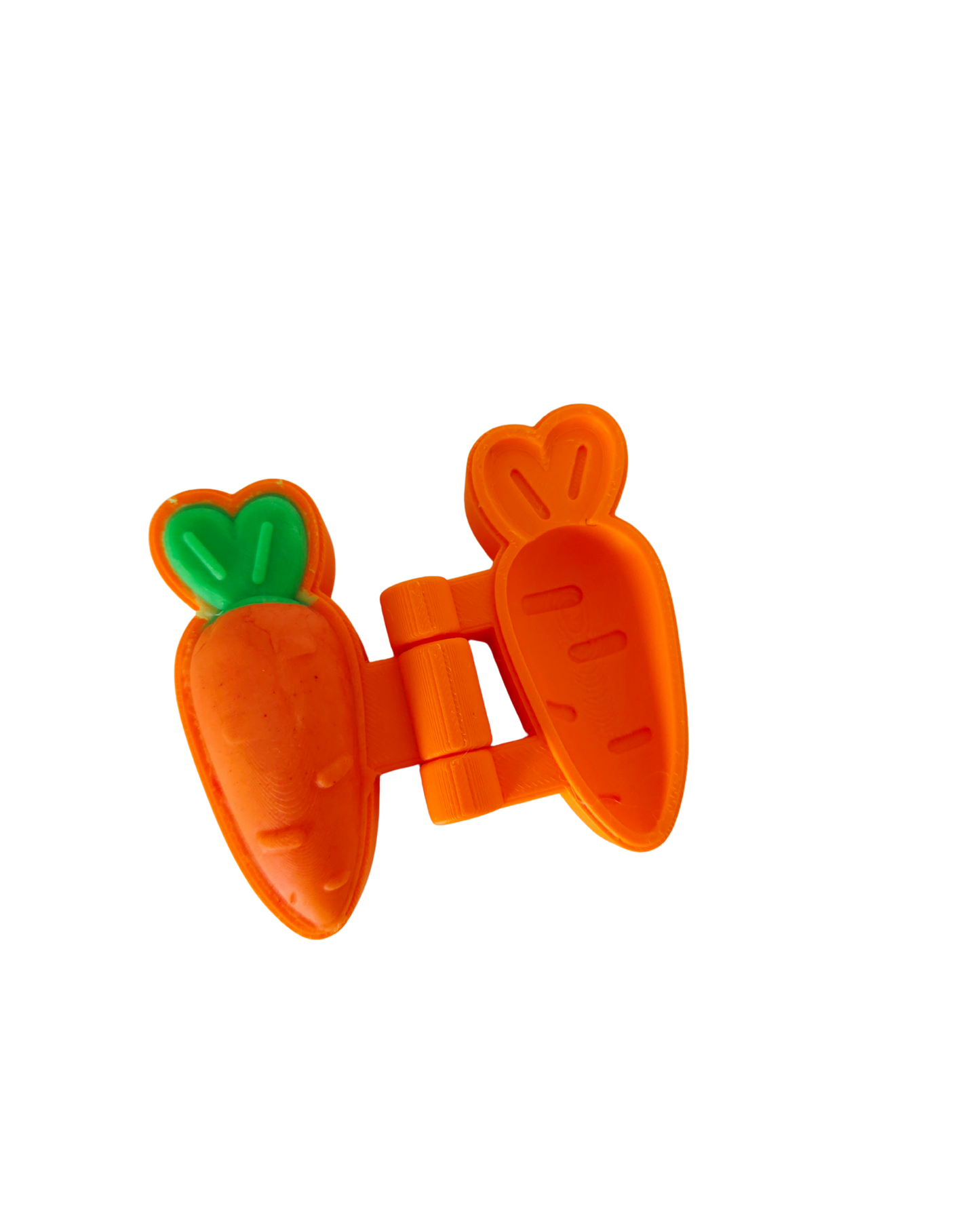 Close-up of orange 3D printed carrot playdough mold by PlayTessori showing hinged two-part design, made from eco-friendly PLA for toddler playdough and sensory play activities