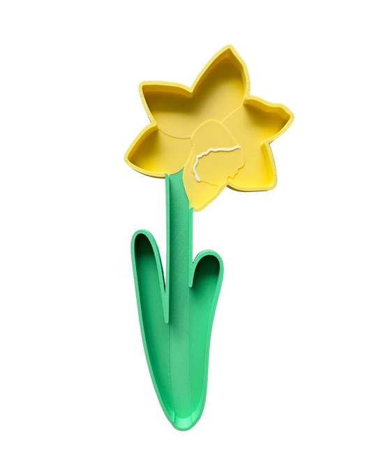 Yellow daffodil sensory play tray with raised trumpet centre, outer petals and bright green stem with curved leaves, 15cm tall, 3D printed from eco bio-PLA — Playtessori Montessori spring garden sensory tray for toddlers