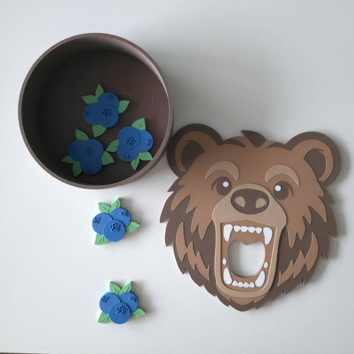 Bear head and den bowl with blueberry counters