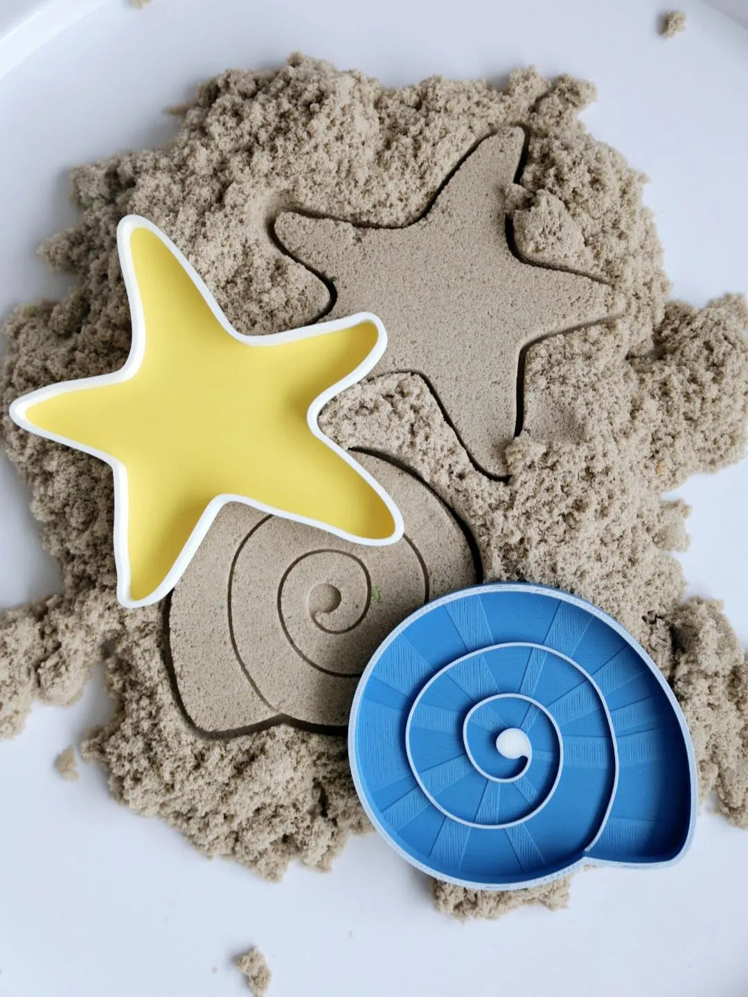 Blue spiral shell sensory tray and yellow starfish sensory tray set, 15cm each, made from eco bio-PLA — Playtessori Montessori ocean sensory play trays for toddlers and preschoolers