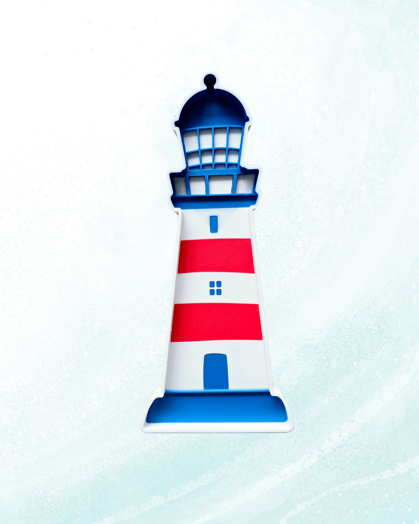Red white and blue lighthouse sensory play tray with raised lantern room grid windows and arched door detail, 21x10cm, handcrafted in Belgium from eco bio-PLA — Playtessori CE marked Montessori coastal nautical sensory tray for toddlers