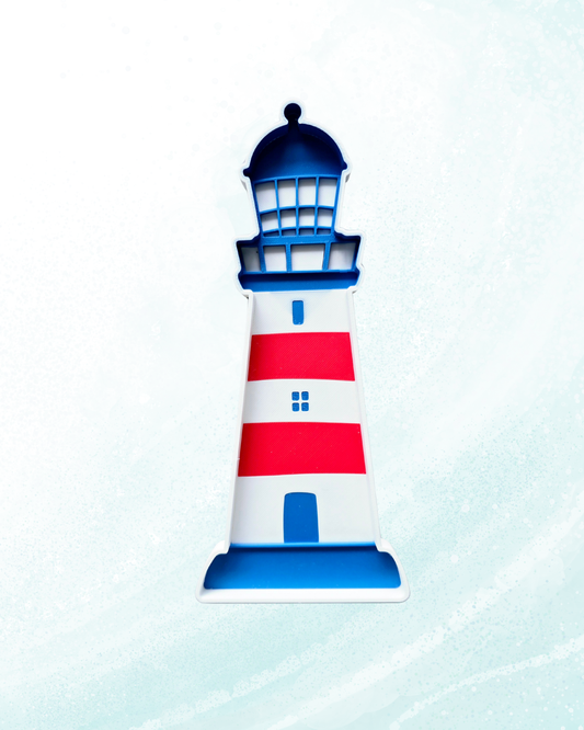 Red white and blue lighthouse sensory play tray with raised lantern room grid windows and arched door detail, 21x10cm, handcrafted in Belgium from eco bio-PLA — Playtessori CE marked Montessori coastal nautical sensory tray for toddlers