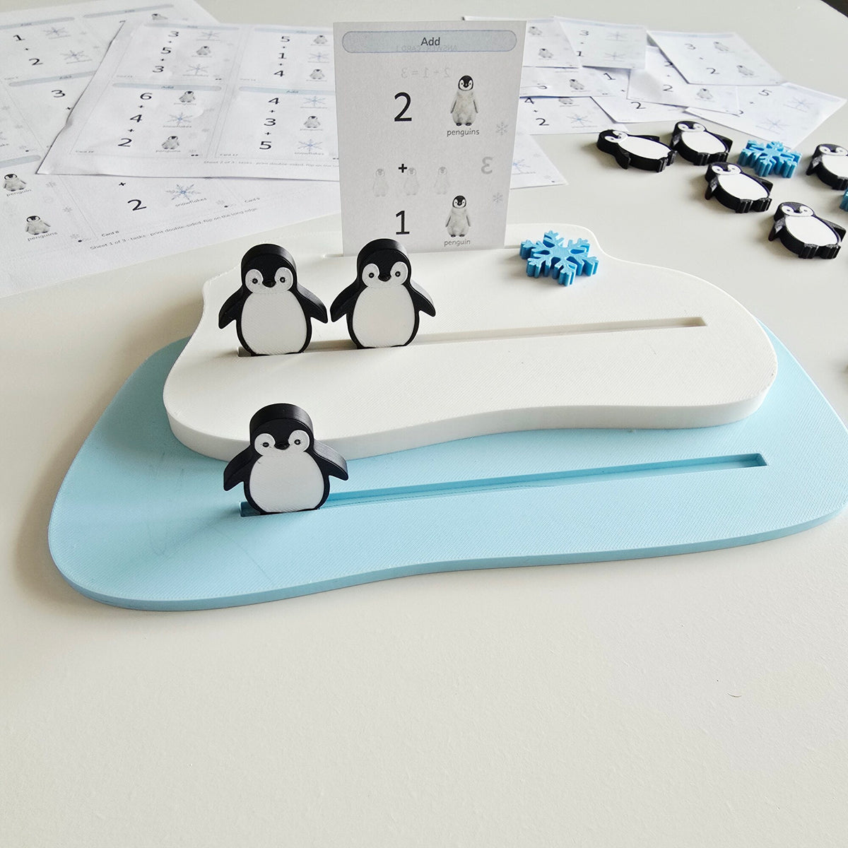 Penguin addition set: two ice floes with penguins and an addition task card