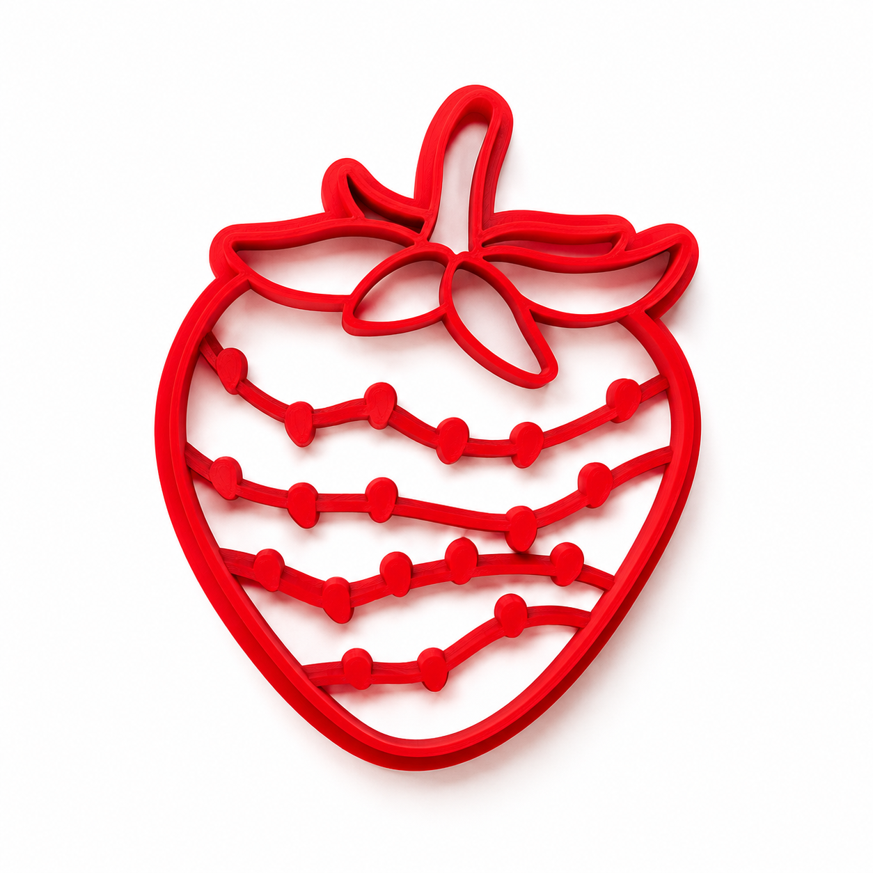Red strawberry-shaped cutter on a white background