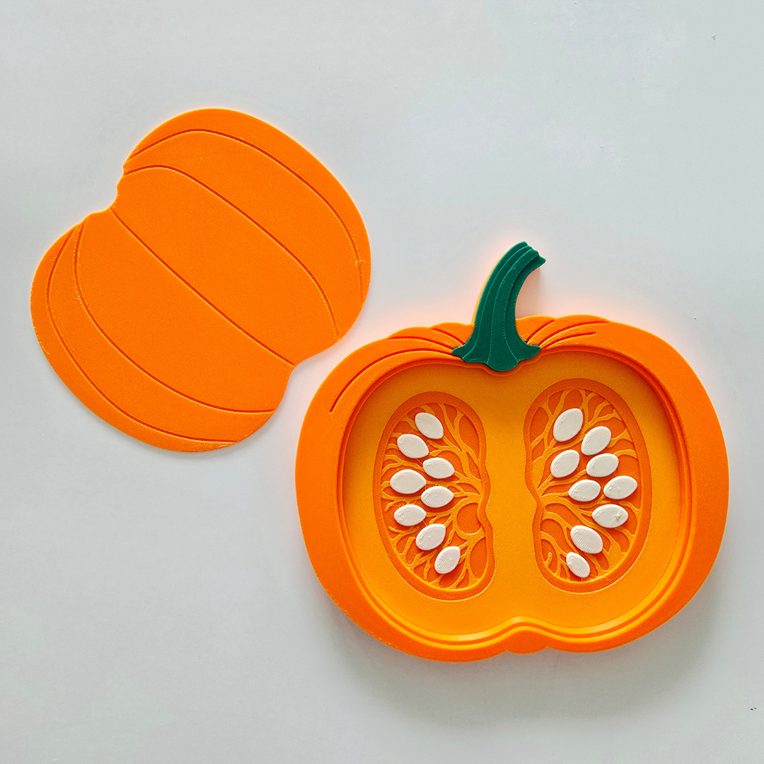 Pumpkin cross section tray with seeds in place and lid, 3D printable STL Montessori sorting toy
