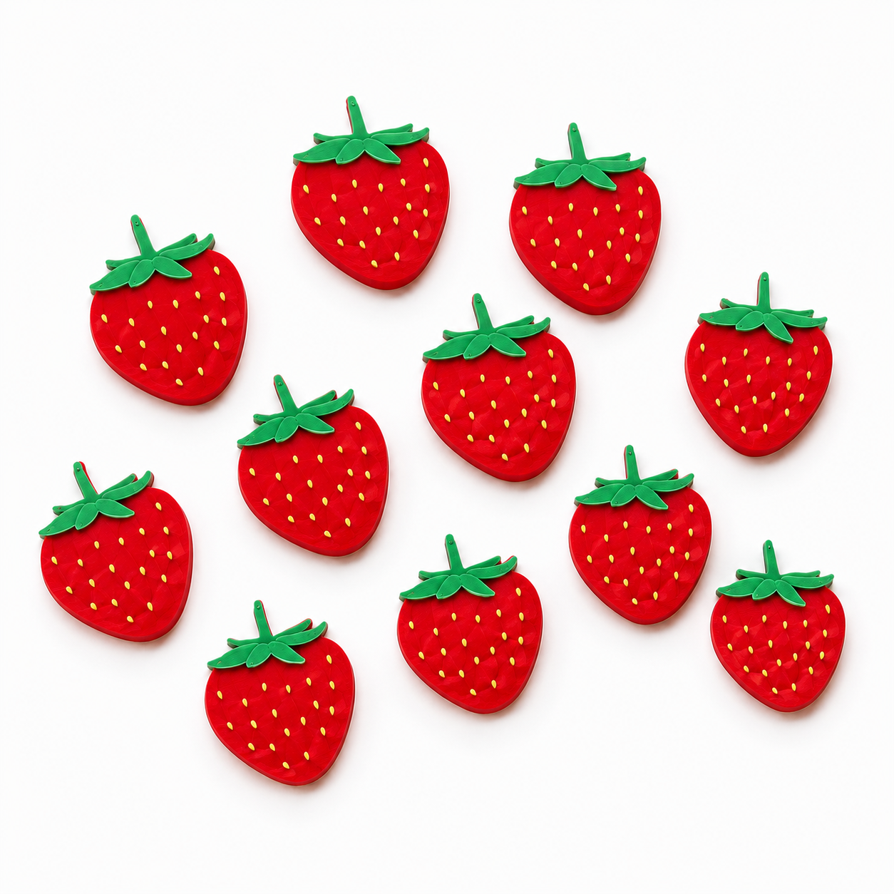 Red strawberry-shaped counters with green leaves on a white background