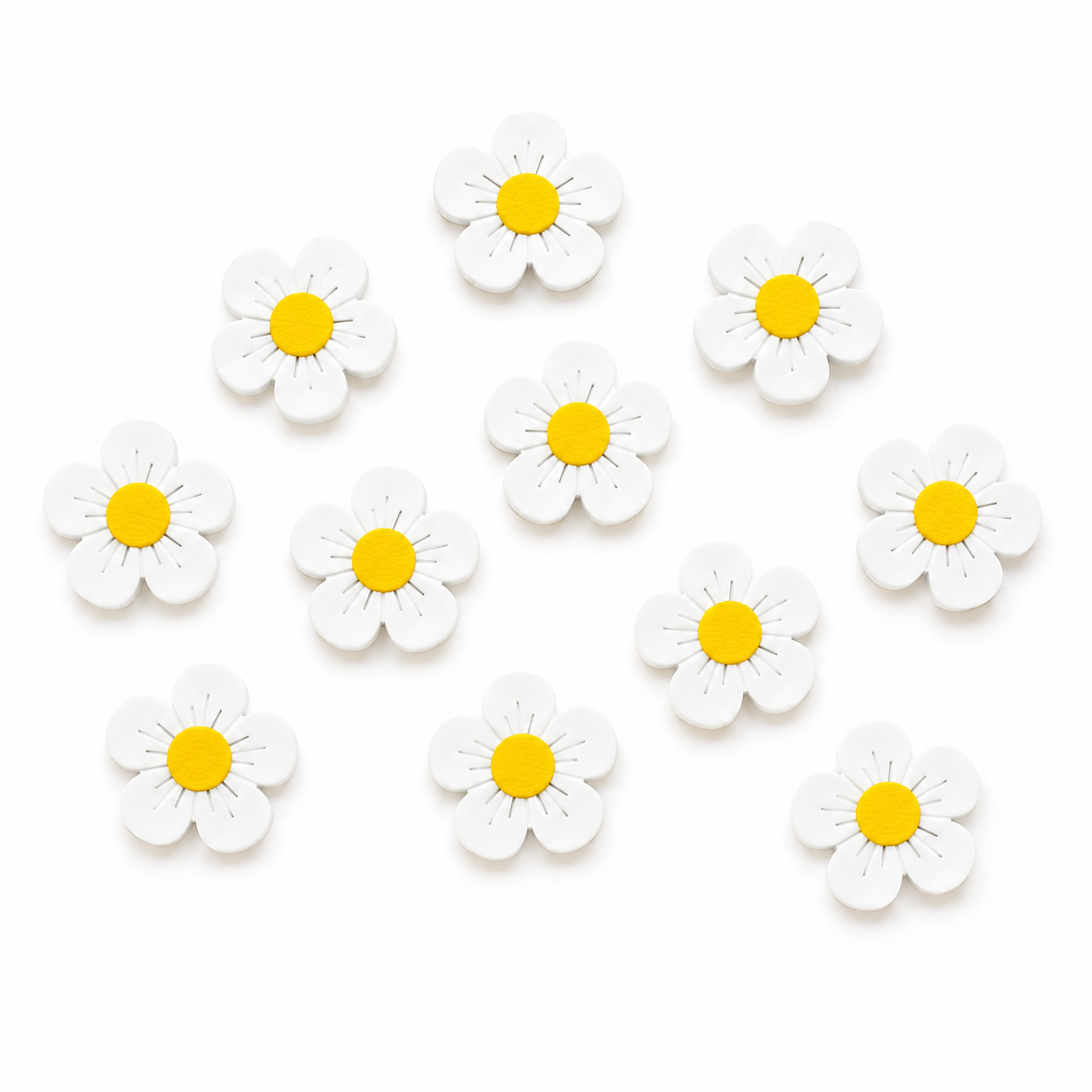 White flowers  counters with yellow centers arranged on a white background