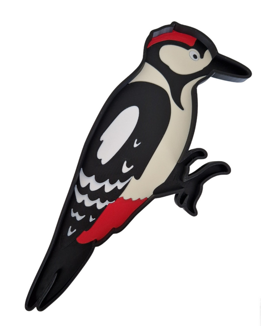 wysypywanka sensoryczna Dzięcioł pokazana na białym tle.